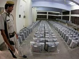 Security guard is seen guarding the EVMs before the assembly elections in Haryana.